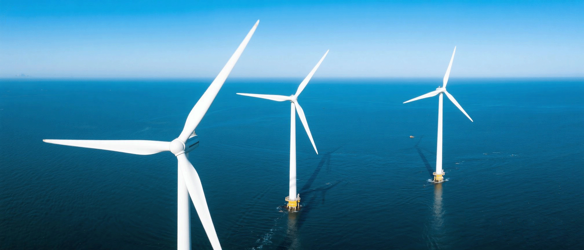 Jimeng-2025-06-26-7398- 三台硕大的风力发电机组在海上 , 占据画面的 4 分之 3 , 天空湛蓝